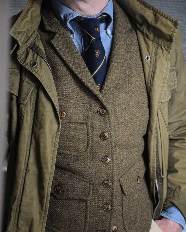 tweed vest over denim shirt with club tie