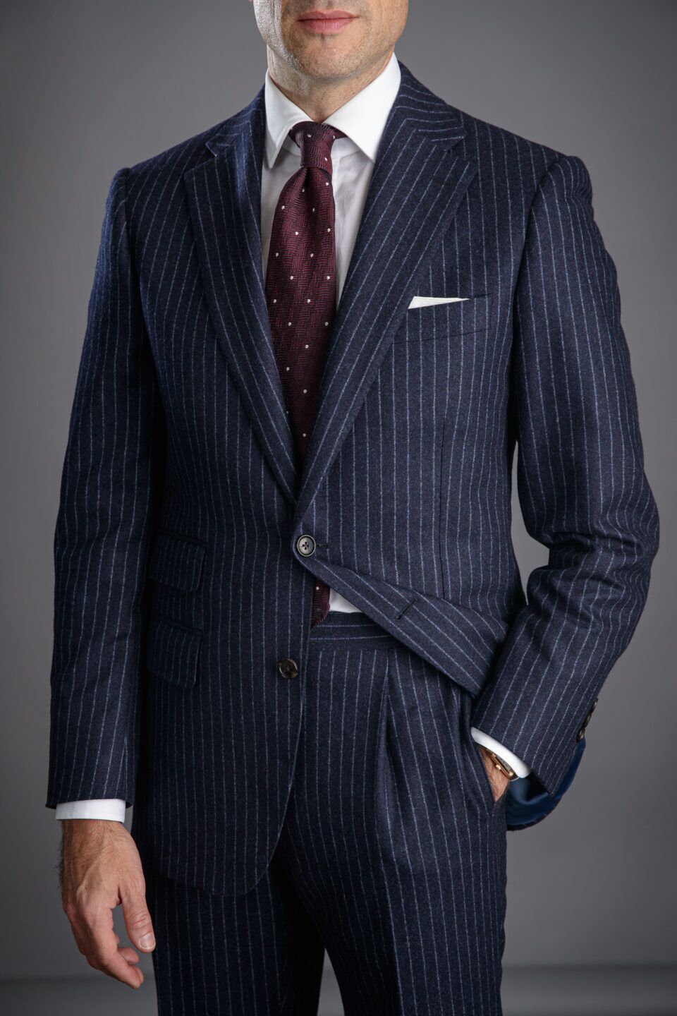 Elegant navy flannel suit featuring narrow chalk stripes for a polished look.