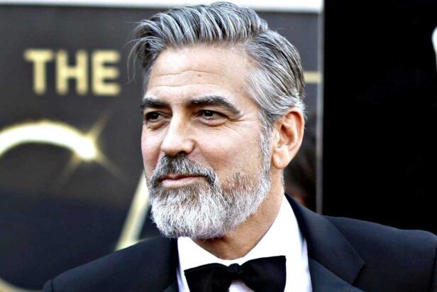 George Clooney with a salt and pepper hair look in a tuxedo