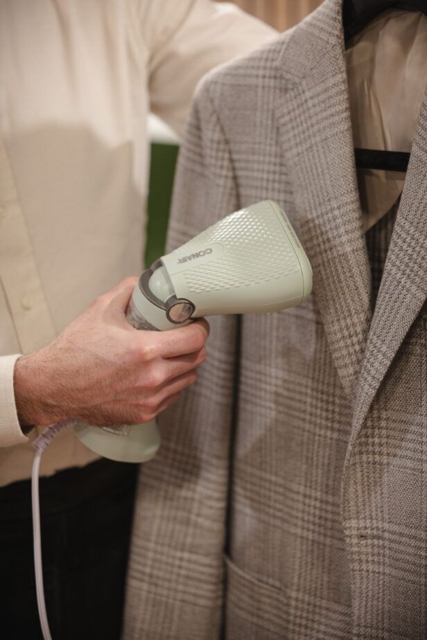 The Conair Power Steam travel steamer in use.