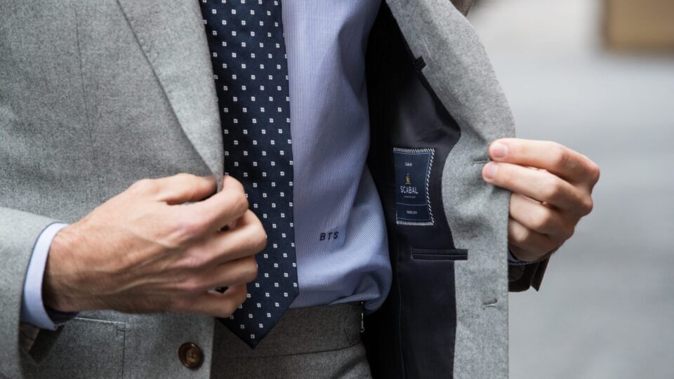 Interior View of Light Gray Suit Jacket – Luxurious Lining and Label Detailing