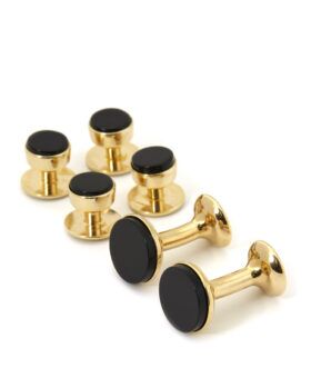Gold and black onyx formal dress set with four shirt studs and two cufflinks, flat lay