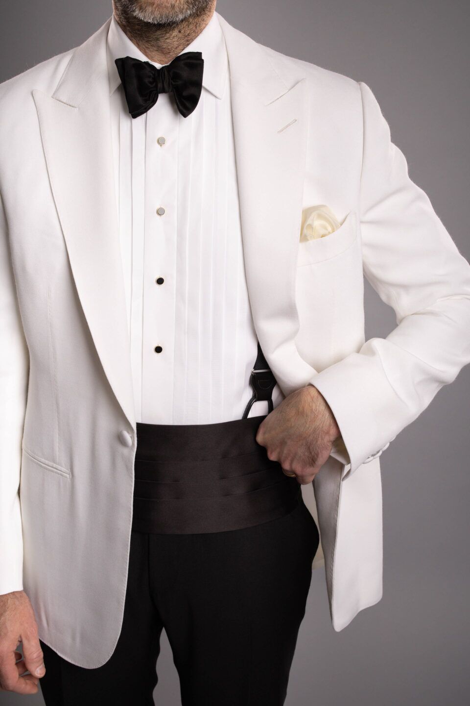Close-Up of Ivory Fabric – Smooth Texture & Sharp Peaked Lapel