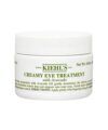 Creamy eye treatment with avocado in a white jar with green lettering, product packaging shot