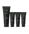 Men's skin care set of four black tubes — face wash, exfoliating scrub, AM and PM moisturizers, packaging shot