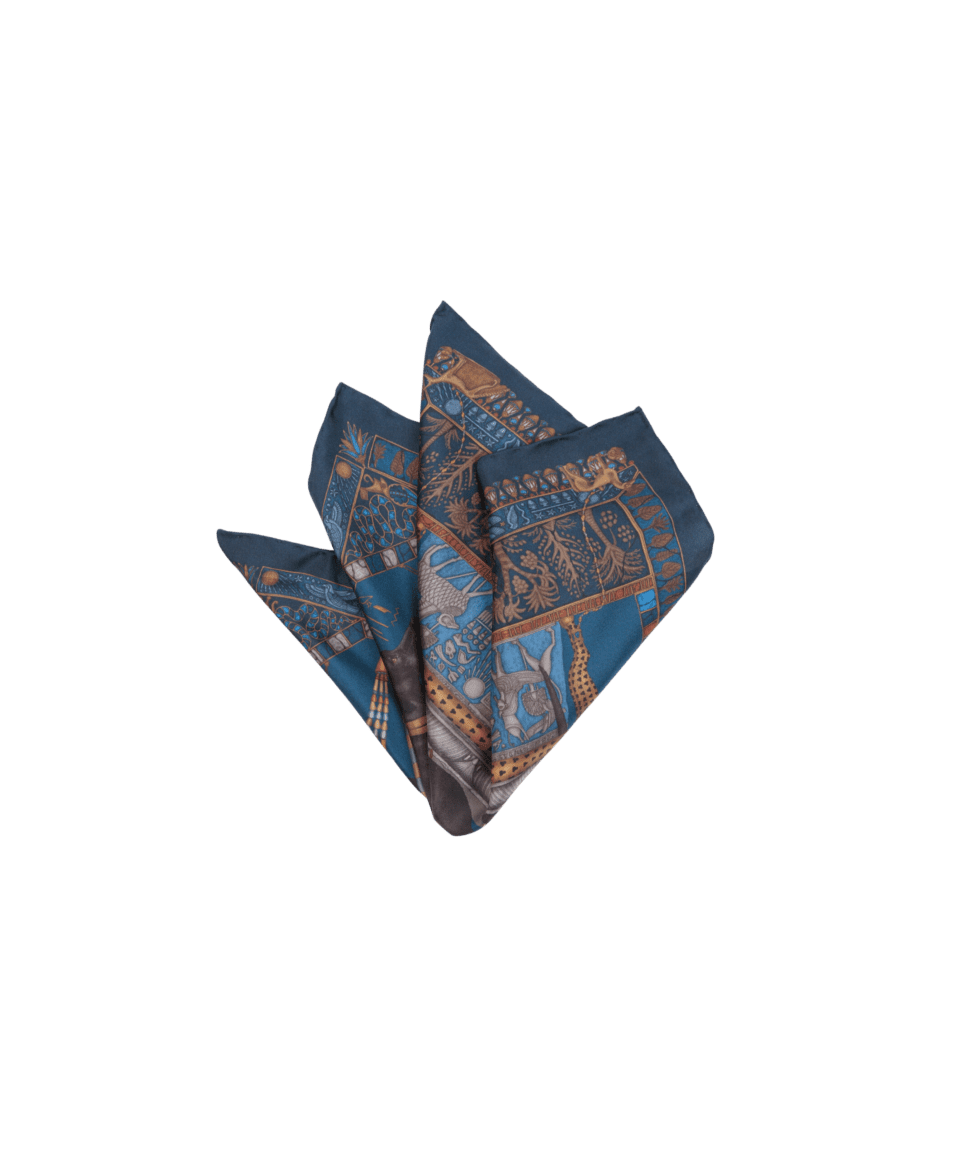 Teal and gold Egyptian-motif printed silk pocket square, folded with multiple points