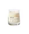 Santal 26 scented candle in clear glass vessel with cream wax and typewriter-style label, product shot