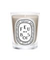 Feu de Bois scented candle in clear glass vessel with black and white oval label, product shot