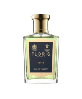 Eau de toilette in a clear glass flacon of pale green fragrance with gold cap and navy label, product shot