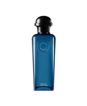 Eau de Citron Noir cologne in a tall blue glass bottle with black domed cap, product shot