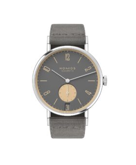 Steel watch with grey dial, cream numerals, subseconds and date, on grey textile strap, flat lay
