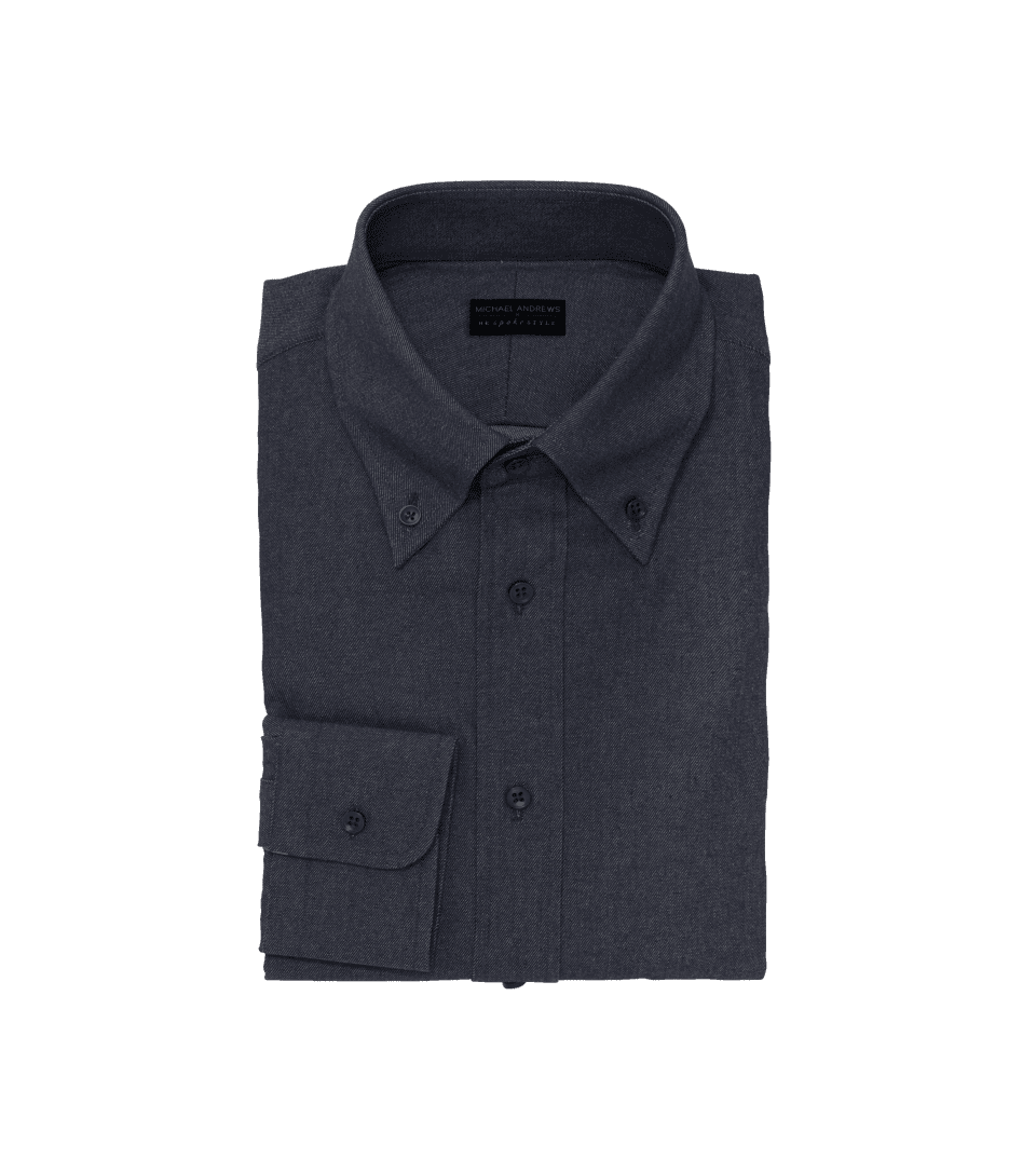 Dark indigo denim button-down collar dress shirt, folded flat lay on black