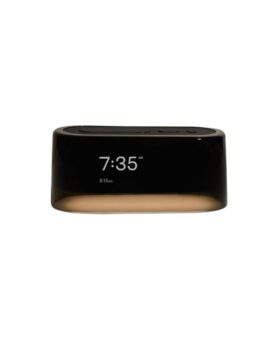 Black Loftie smart alarm clock with white digital display and amber glow