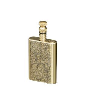 Brass permanent match lighter with engraved scrollwork and screw-top striker, on a white background