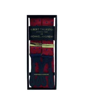 Burgundy suspenders with navy dots and gold hardware, in a gift box