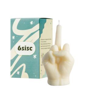 Cream candle moulded as a hand making a rude gesture, beside its printed box