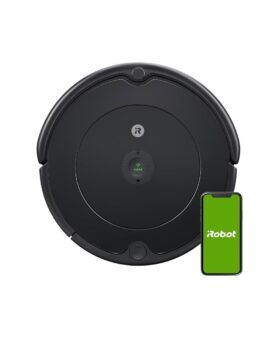 Black round robot vacuum beside a smartphone showing the control app