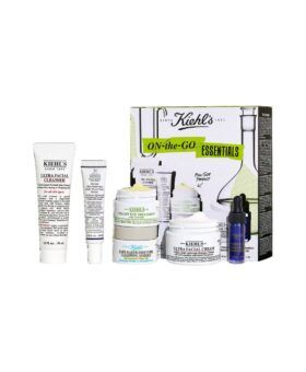 Kiehl's On-the-Go Essentials skincare set arranged beside its printed box