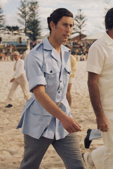 Pale blue belted safari shirt jacket with patch pockets, worn on a sandy beach