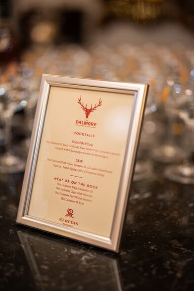 Framed Dalmore whisky cocktail menu on a marble bar at the St Regis Florence