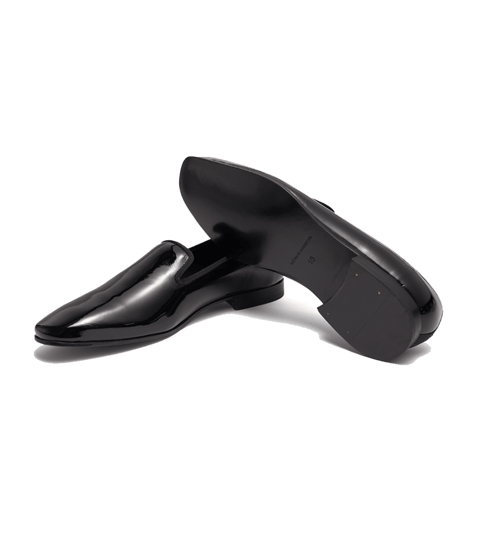 Black patent leather formal slippers, one shown on its side to reveal the leather sole