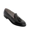 Black shell cordovan tassel loafer with leather sole, single shoe angled product shot