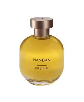 Nanban eau de parfum in a rounded glass bottle of amber liquid with rose gold cap, product shot