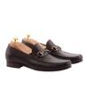 Dark brown leather horsebit loafers with moc-toe stitching and silver bit, shown as a pair with shoe trees