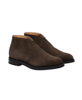 Brown suede chukka desert boots with black rubber soles, product shot of the pair