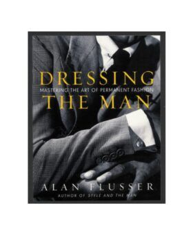"Dressing the Man" menswear book by Alan Flusser, cover showing a glen check suit in black and white