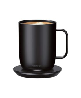 Black temperature-control smart mug filled with coffee, resting on its matching charging coaster, product shot