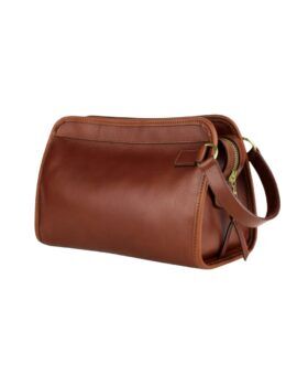 Chestnut brown tumbled leather travel kit with brass zipper and carry handle, side view