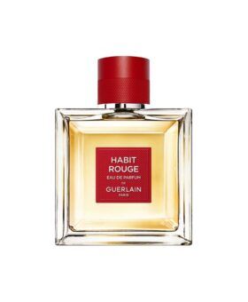 Habit Rouge eau de parfum in a square glass bottle with red label and red cap, product shot