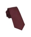 Burgundy silk necktie with mini white dots, rolled flat lay