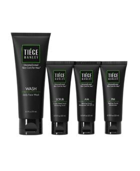 Men's skin care set of four black tubes — face wash, exfoliating scrub, AM and PM moisturizers, packaging shot