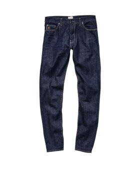 Indigo rinse selvedge denim slim-fit jeans with contrast tan stitching, flat lay