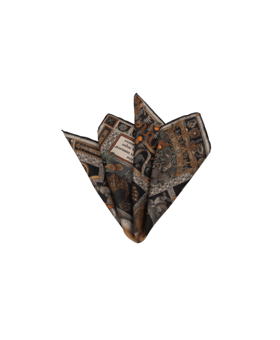 Black silk pocket square with ornate animal and botanical print in rust, gold and green, folded