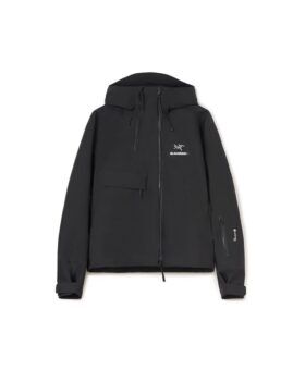 Black hooded Gore-Tex shell jacket with full zip and chest pocket, flat lay