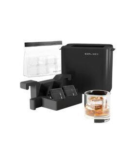 Black clear ice cube maker set with mold, storage bag and whiskey glass, flat lay
