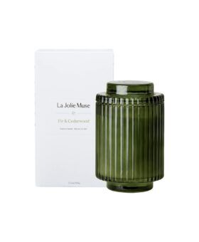 Fir and cedarwood soy candle in ribbed green glass jar with lid, shown with its white gift box