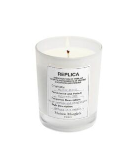 Winter Stroll scented candle in a clear glass jar with white Replica label, product shot