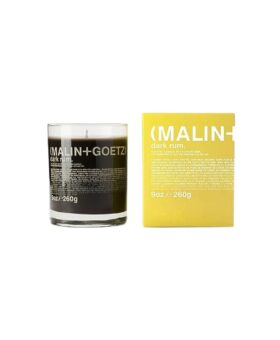 Dark rum scented candle in a clear glass jar, 9 oz, shown beside its yellow box