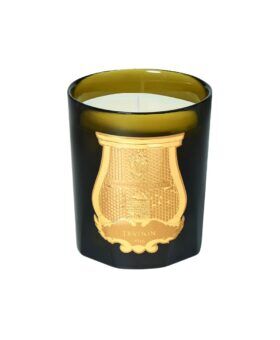 Scented candle in green glass vessel with gold crest medallion, product shot