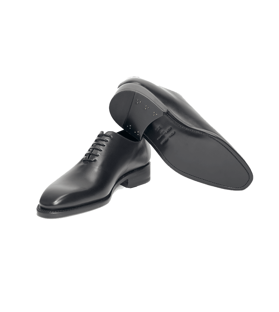 Black box calf wholecut lace-up oxfords, pair shown with leather sole visible