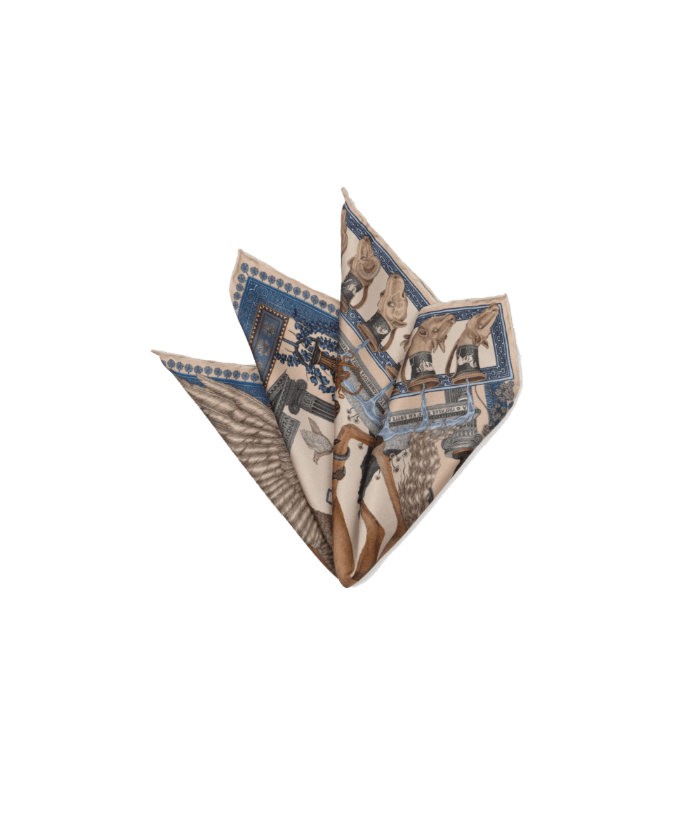 Beige and blue Greek temple print silk pocket square, folded in a multi-point puff, flat lay