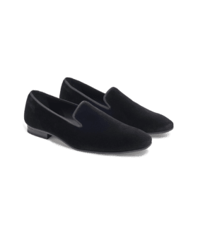 Black velvet formal slippers with grosgrain trim and leather soles, product shot of the pair