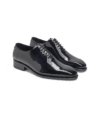 Black patent leather wholecut oxford formal shoes, pair shown at an angle