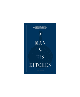 "A Man & His Kitchen" by Matt Hranek, navy hardcover book with skillet motif, front cover view
