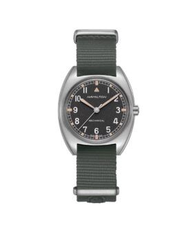 Mechanical pilot watch with black dial, steel tonneau case and green NATO strap, flat lay