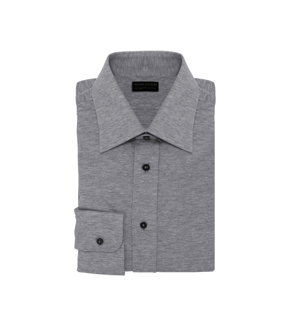 Light grey cotton pique dress shirt with spread collar and dark buttons, folded flat lay